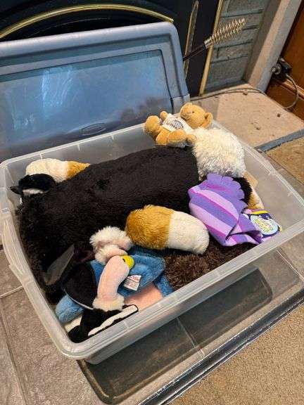Plastic Storage Bin Containing Assorted Plush Toys