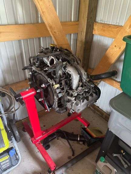 Used Subaru Boxer Engine Mounted on a Red Engine Stand