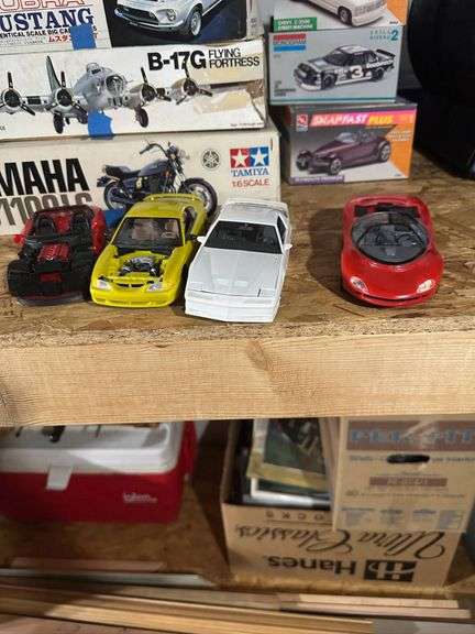 Four Model Car Kits with Additional Parts