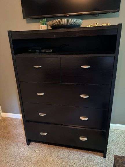 Black Five-Drawer Wooden Dresser with Open Shelf and Metal Pulls