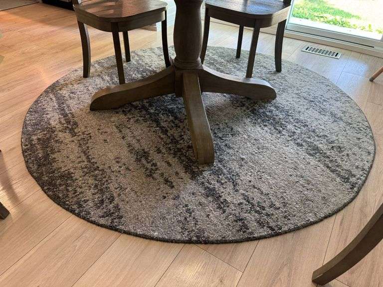 Round Gray and Black Area Rug with Distressed Patterning