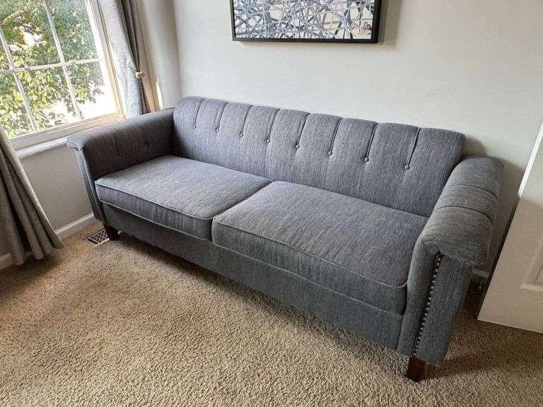 Gray Upholstered Three-Seat Sofa with Studded Armrest Detailing