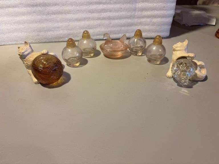 perfume bottles and pink depression hen