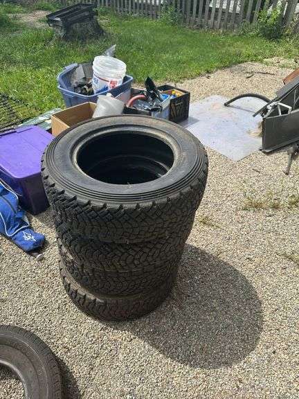 Four Used All-Terrain Tires with Tread Pattern