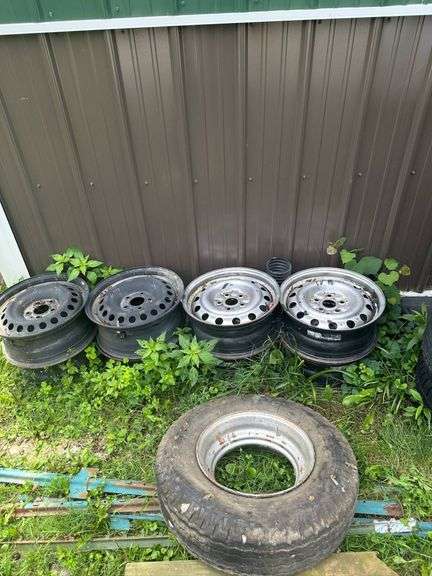 Steel Car Wheels and One Rubber Tire