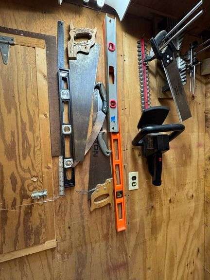 Tools Including Hand Saws, Levels, and Electric Hedge Trimmer