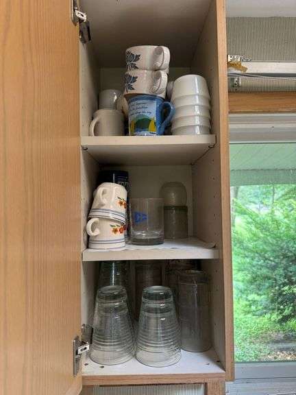 Ceramic Mugs and Glassware in Wooden Cabinet