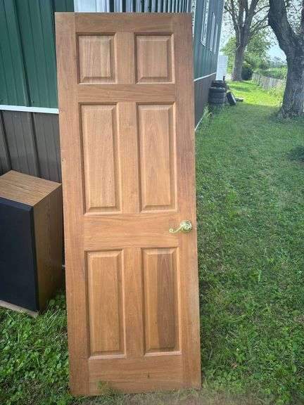 Six-Panel Solid Wood Door with Brass Lever Handle