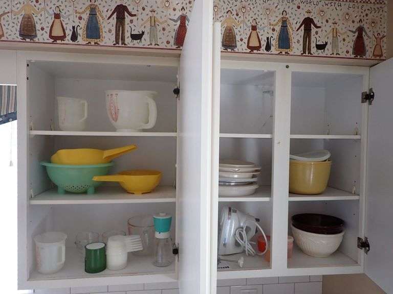 Cabinet Cleanout Including KitchenAid Hand Mixer, Mixing Bowls, and Measuring Tools
