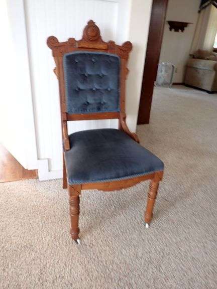 Carved Wood Accent Chair with Blue Upholstery and Casters