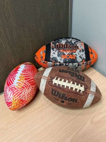 Three Wilson Footballs in Various Designs