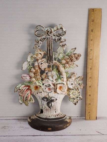 A Hubley Cast Iron Flower Basket Door Stop