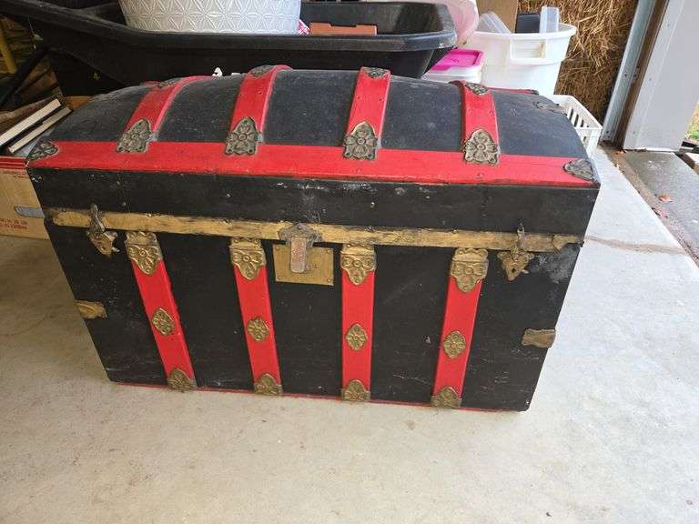 Red and black steamer trunk