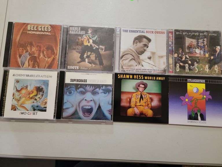Assorted Cds Strangebyrds, Shawn Hess, Super Grass, Alchemy Dire Straits, BR5-49, Buck Owens, Merle 