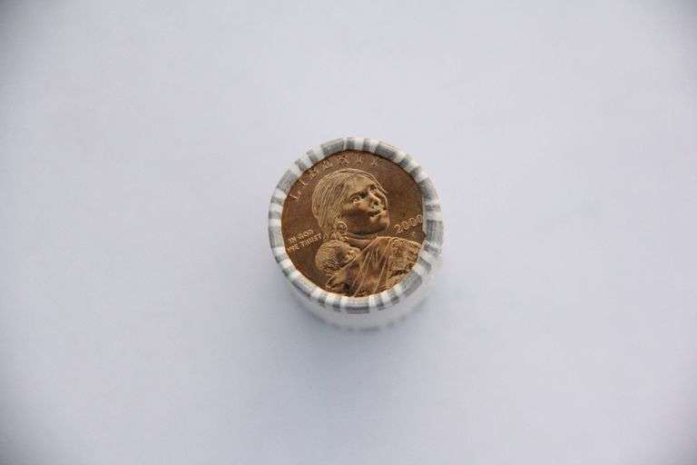 A roll of 2000 P Sacajawea gold coins. Brilliant uncirculated