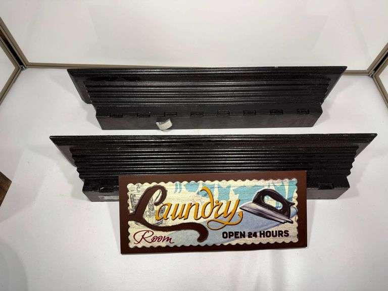 Black Wooden Floating Wall Shelves and Decorative Laundry Room Sign