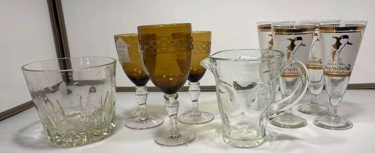 Glassware Lot Including Amber Goblets, Penguin Glasses, and Pitcher