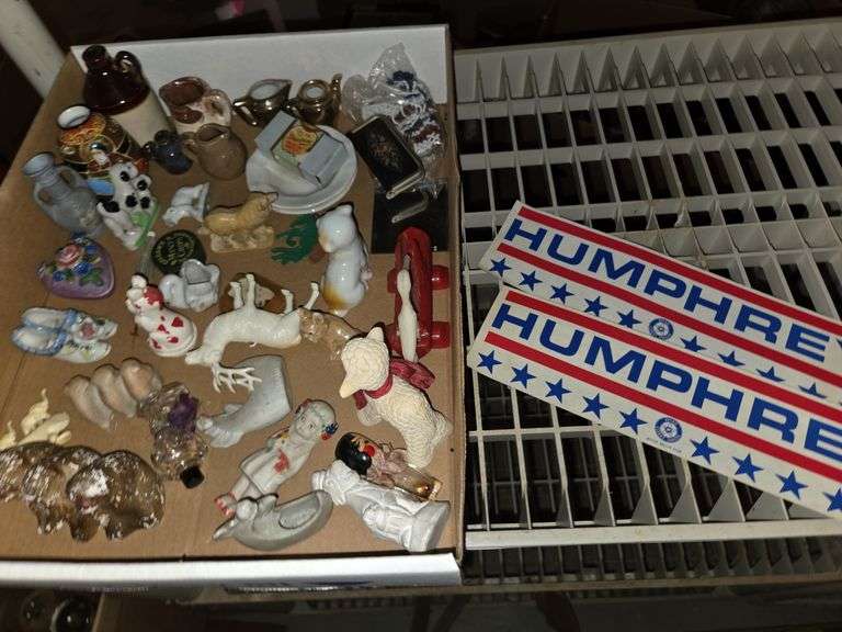 Variety of collectible figurines in foreign collectibles