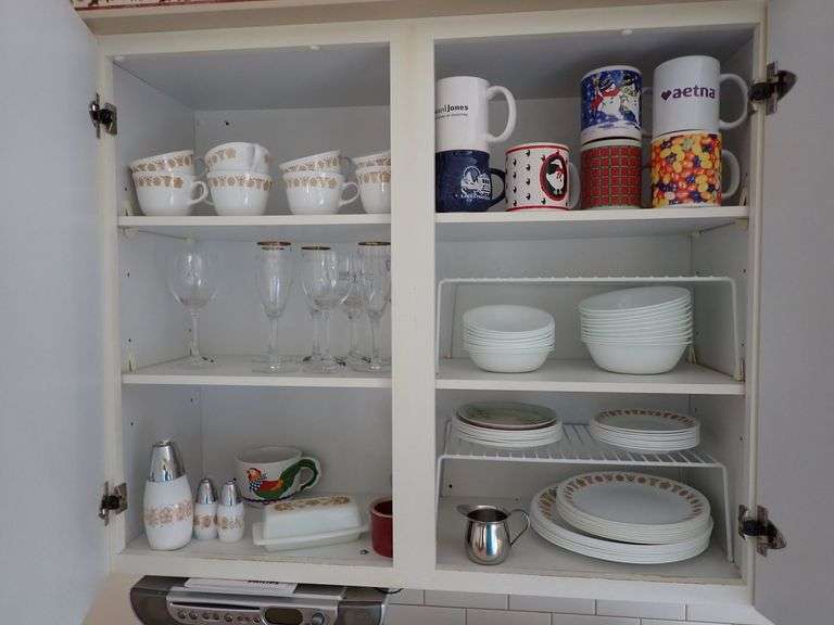 Cabinet Contents Including Dinnerware, Glassware, and Kitchenware