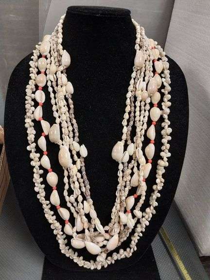 Seven Shell Necklaces Featuring Natural and Red Accents