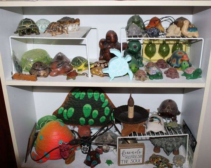 Shelf Display of Assorted Turtle Figurines and Decorations - Auction Ohio