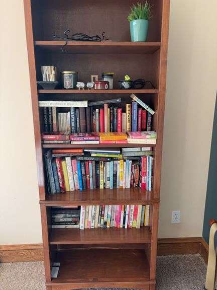 Wooden Bookshelf With Books Assortment