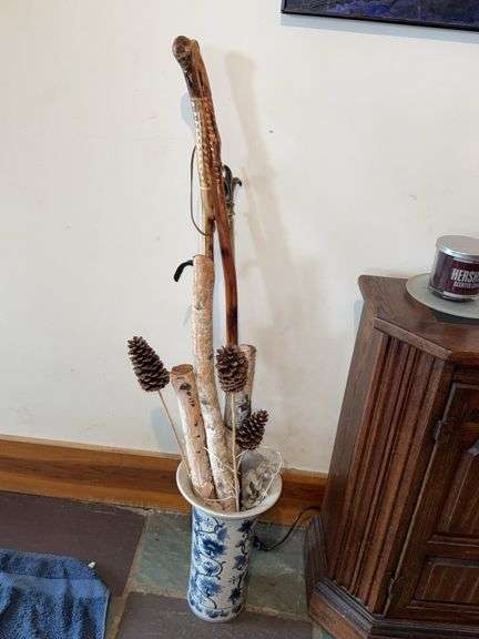 Blue and White Ceramic Vase With Wooden Sticks, Pinecones, and Walking Sticks