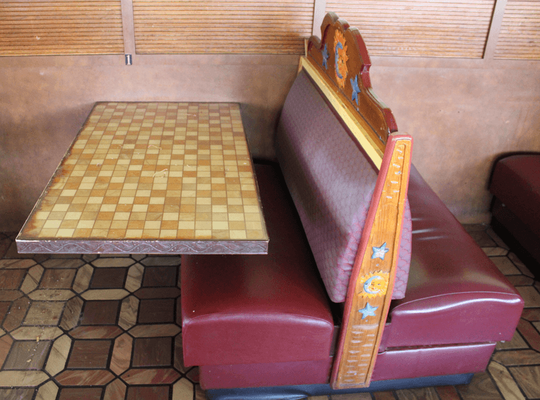 Restaurant Booth and Mounted Table with Decorative Backrest - Auction Ohio