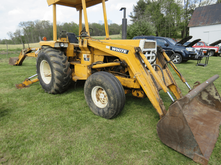 White Tractor Loader Backhoe