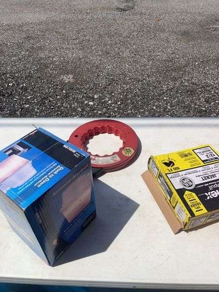 Electrical Supplies Including Cooper Dusk-to-Dawn Light, Romex Cable, and Assorted Parts