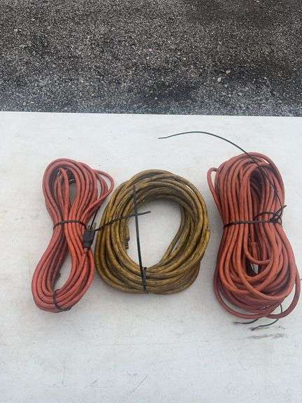 Three Electrical Extension Cords in Orange and Yellow