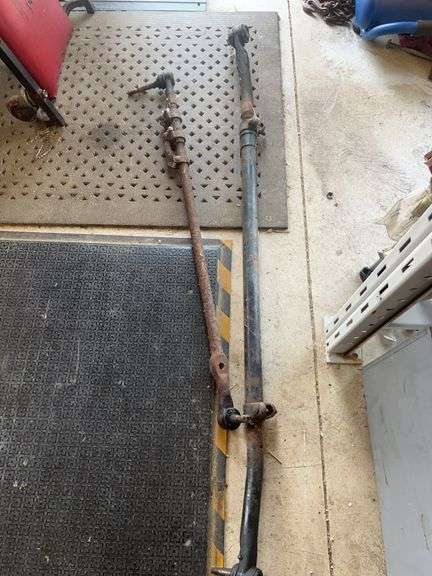 Two Rusted Automotive Steering or Suspension Linkage Components