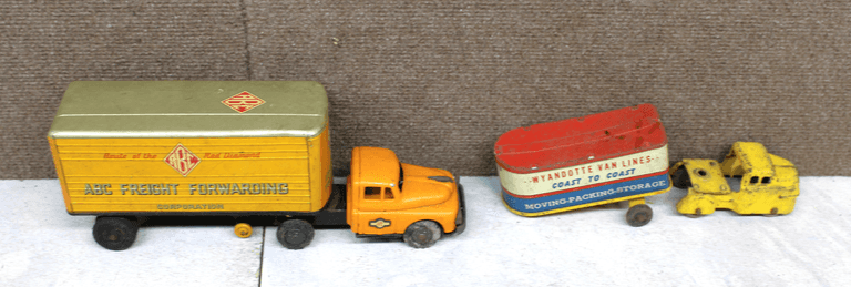 Two Vintage Tin Litho Toy Trucks: ABC Freight Forwarding and Wyandotte Van Lines