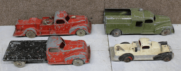 Four Die-Cast Metal Toy Trucks, Various Models