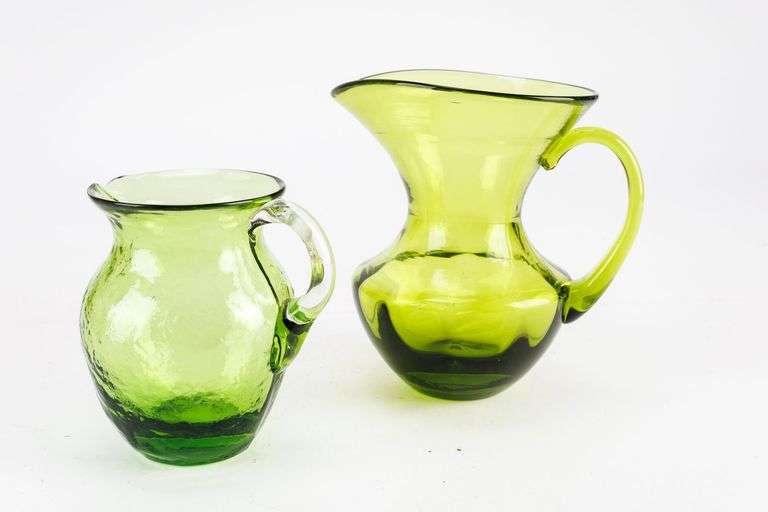 Group of Two Small Green Art Glass Pitchers
