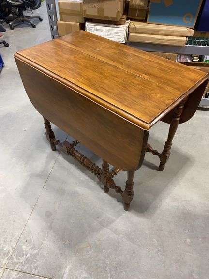 Vintage wooden drop-leaf table.