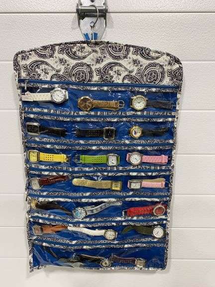 Large collection of assorted wristwatches with a hanging organizer.
