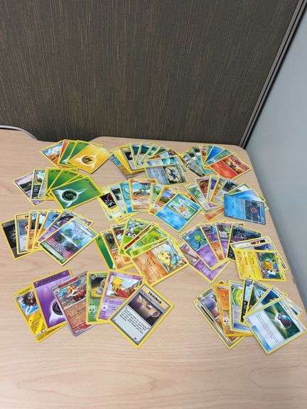 Over 70 Pokémon Trading Cards Including Trainer, Energy, and Various Pokémon Types, Mixed Sets