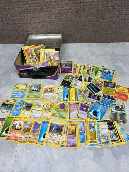 Large Assortment of Pokémon Trading Cards in Pikachu and Charizard Collector’s Tin Case, Mixed Sets 