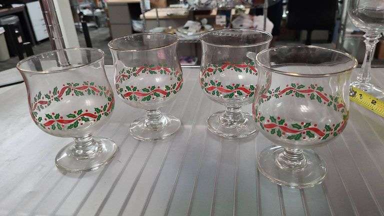 Four Holiday-Themed Footed Glass Goblets With Holly and Ribbon Design, Gold-Rimmed, Clear Glass