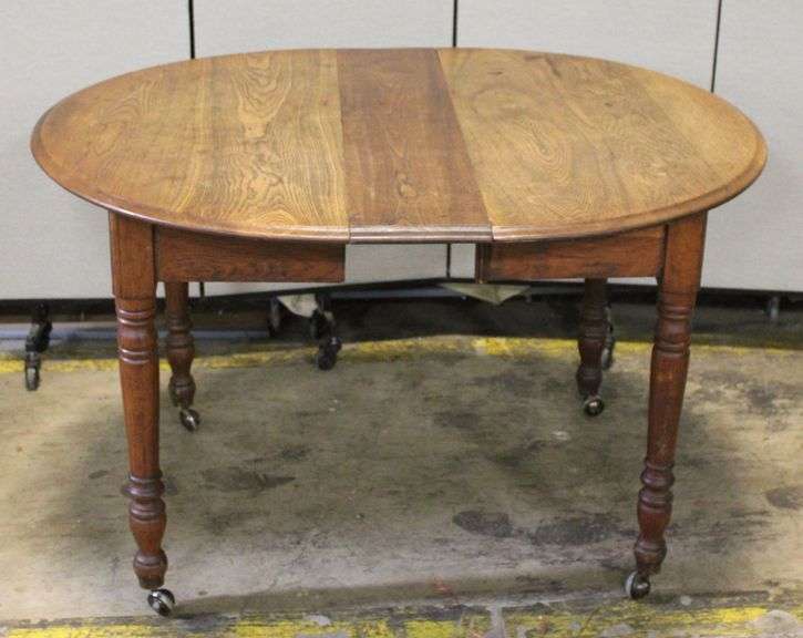 Wood Dining Table with Turned Legs and Casters