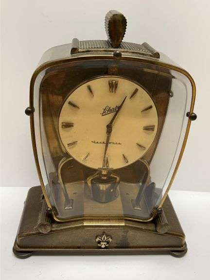 Schatz Electonic Brass Mantel Clock With Fleur-De-Lis Embellishment and Curved Glass Case