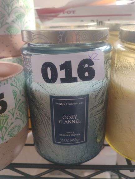 Huntington Home Cozy Flannel Scented Candle, 16 oz. A 16 oz, 2-wick scented candle in a decorative embossed glass jar, featuring a warm 'Cozy Flannel' fragrance. - $4.49