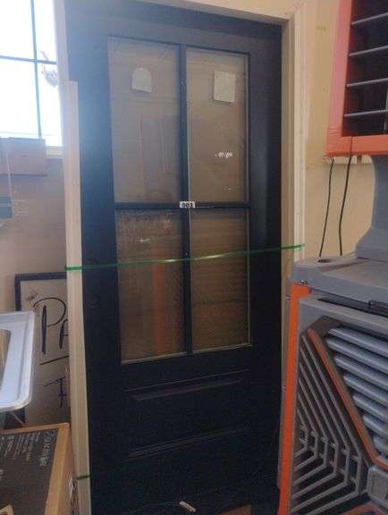 6-Lite Paneled Interior Door. A traditional black door featuring six lites with frosted or privacy glass panels, set above a solid lower panel. - $250 - 450