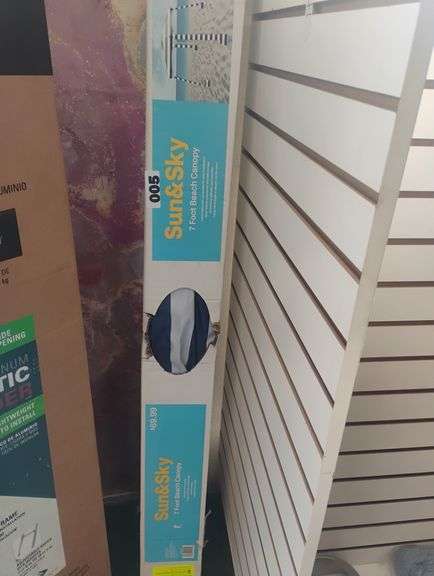 Sun & Sky 7 Foot Beach Canopy. A lightweight, 7-foot canopy for the beach featuring UPF 50+ UV protection, a sand auger for stability, and a matching carry bag. - $69.99