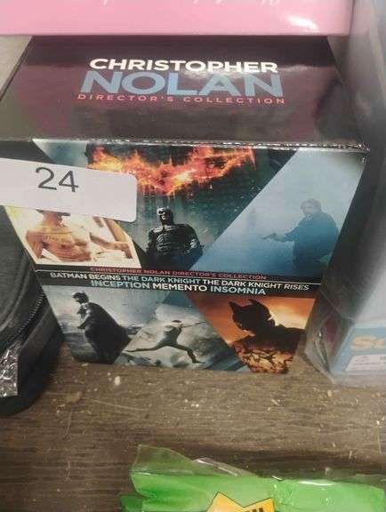 Christopher Nolan Director's Collection DVD Box Set. A box set containing six films directed by Christopher Nolan: Batman Begins, The Dark Knight, The Dark Knight Rises, Inception, Memento, and Insomnia. - $25 - 40