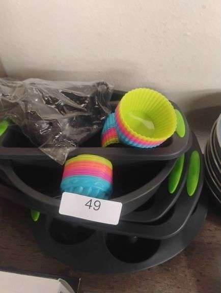 Silicone Muffin Pan and Reusable Baking Cups Set. A bakeware set including non-stick muffin pans with silicone grips and reusable silicone liners for baking cupcakes and muffins. - $20 - 30