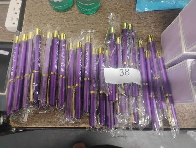 Custom Engraved 'Class of 2025' Graduation Pen. A purple and gold retractable pen engraved with 'Class of 2025' as a commemorative graduation gift. - $1.50 - 3.00