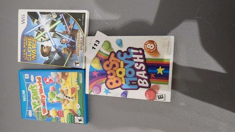 LOT OF WII/WII U GAMES LUCASARTS STAR WARS THE CLONE WARS LIGHTSABER DUELS, MAJESCO BUST A MOVE BACH, AND NITENDO YOSHI'S WOOLY WORLD, SOLD BY PIECE