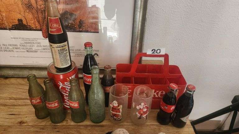 COKE COLLECTION, INCLUDES BOTTLE CARRIER, MULTIPLE BOTTLES EMPTY AND FILLED, A STORAGE CANISTER AND 2 CHRISTMAS COLLECTION GLASSES